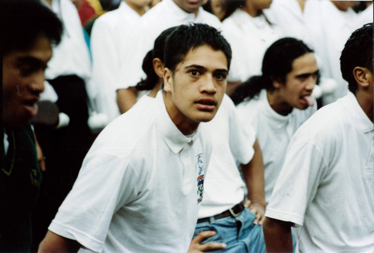 A young man performing a haka